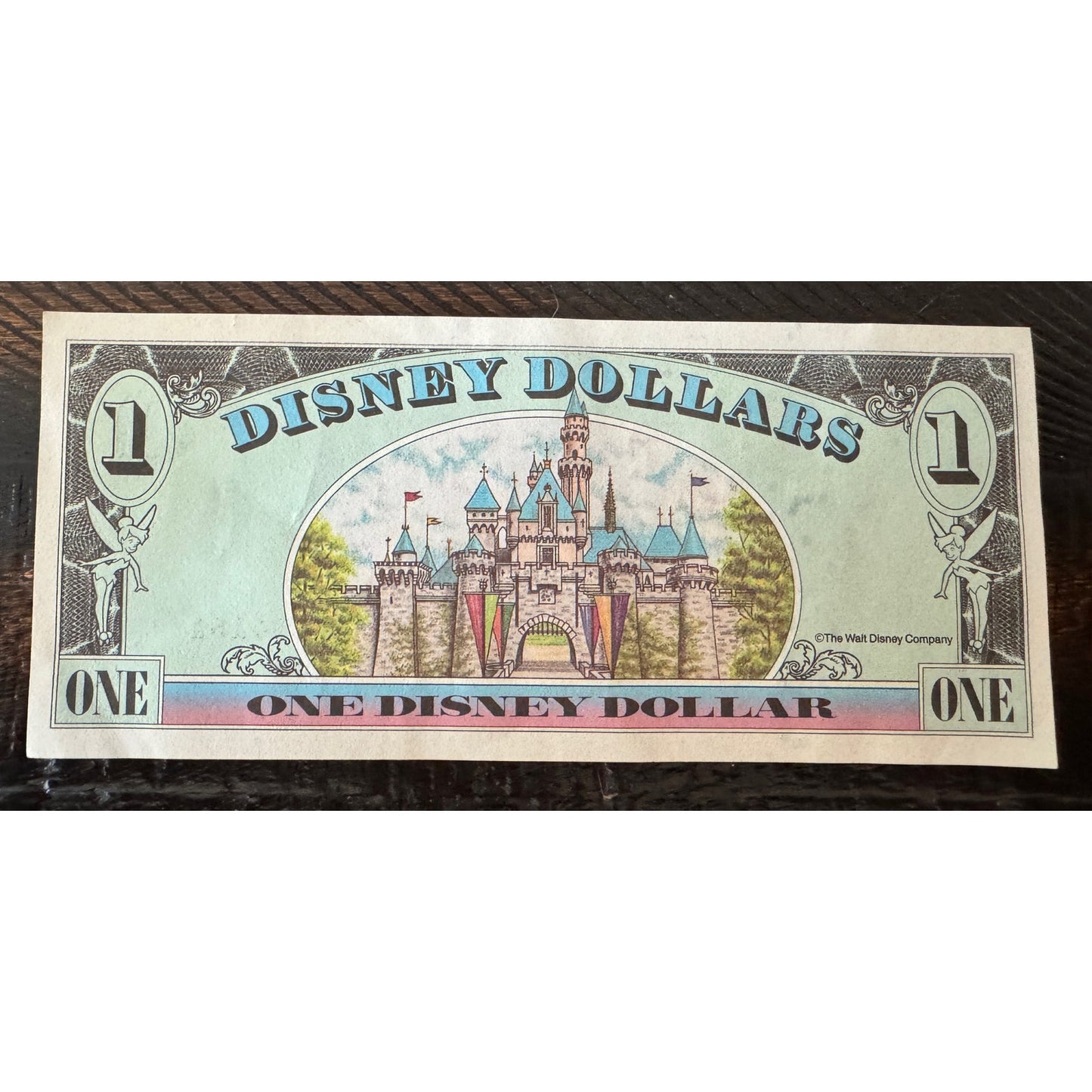 Disney Dollar Mickey 1999 $1 1 dollars serial number. A00452415A. No folds or tares. front feature is Mickey Mouse and the back features Cinderella castle.