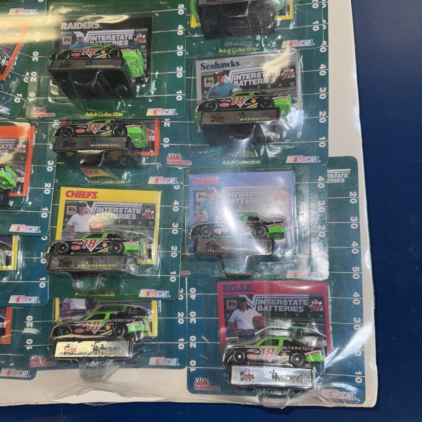1992 NFL NASCAR Racing Champions Set – 28 Cars Shrink-Wrapped on Display Board