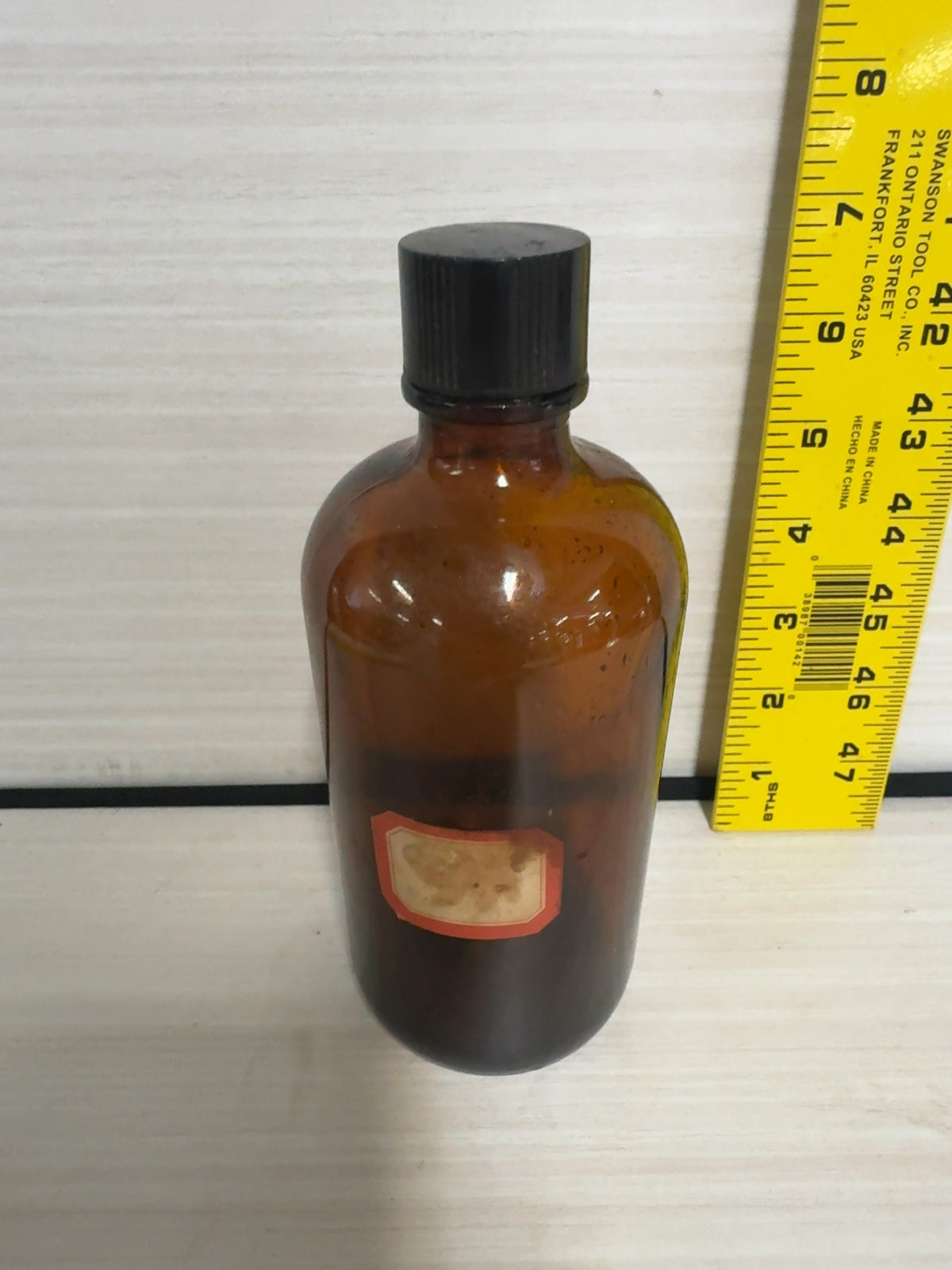Vintage Amber Glass Boston Round Bottle with Black Bakelite Cap
