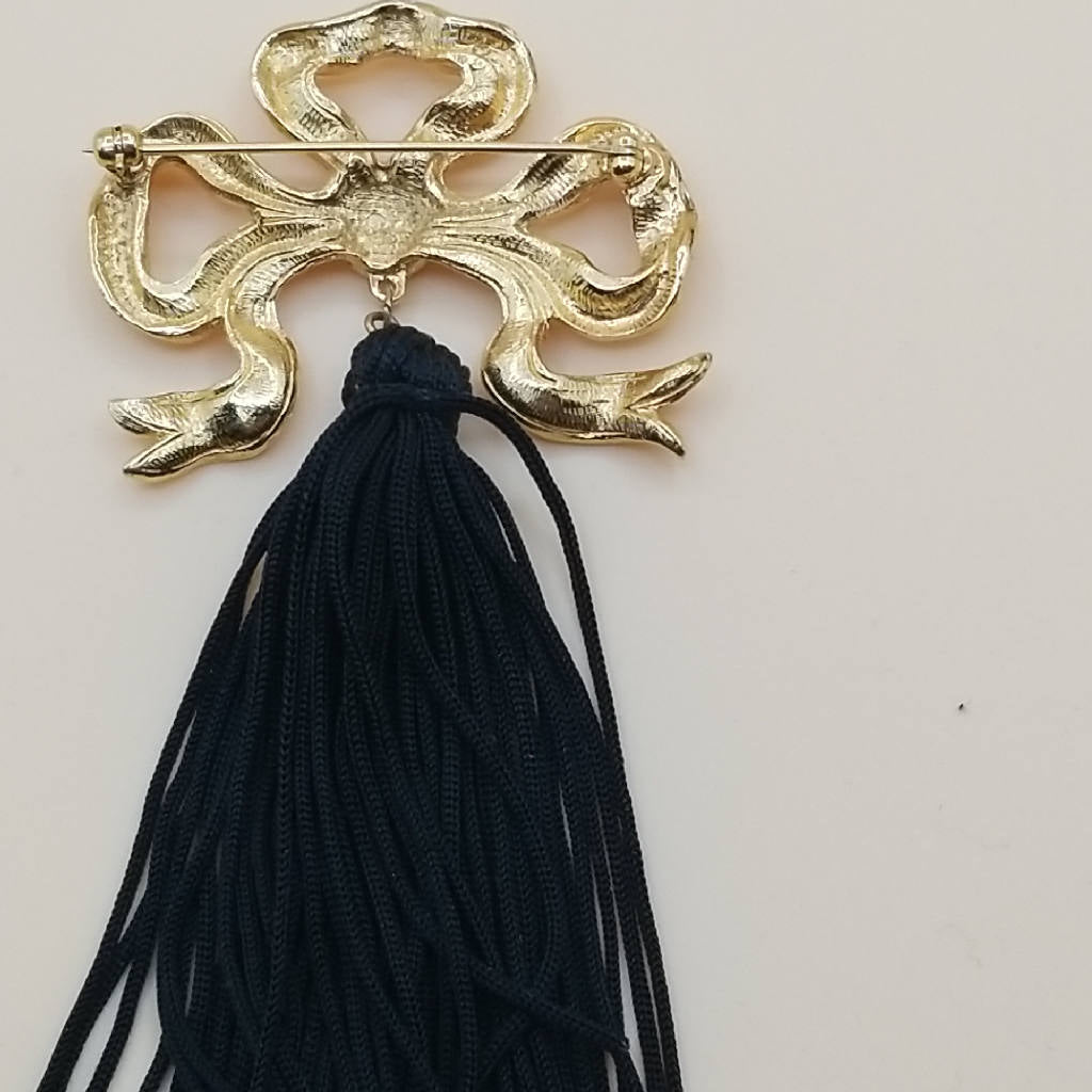 Stunning Gold Tone Bow Brooch with Black Tassel