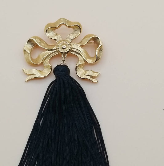 Stunning Gold Tone Bow Brooch with Black Tassel
