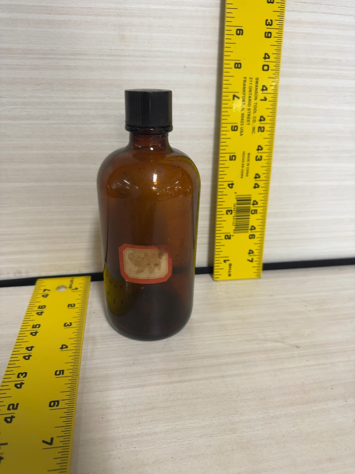 Vintage Amber Glass Boston Round Bottle with Black Bakelite Cap