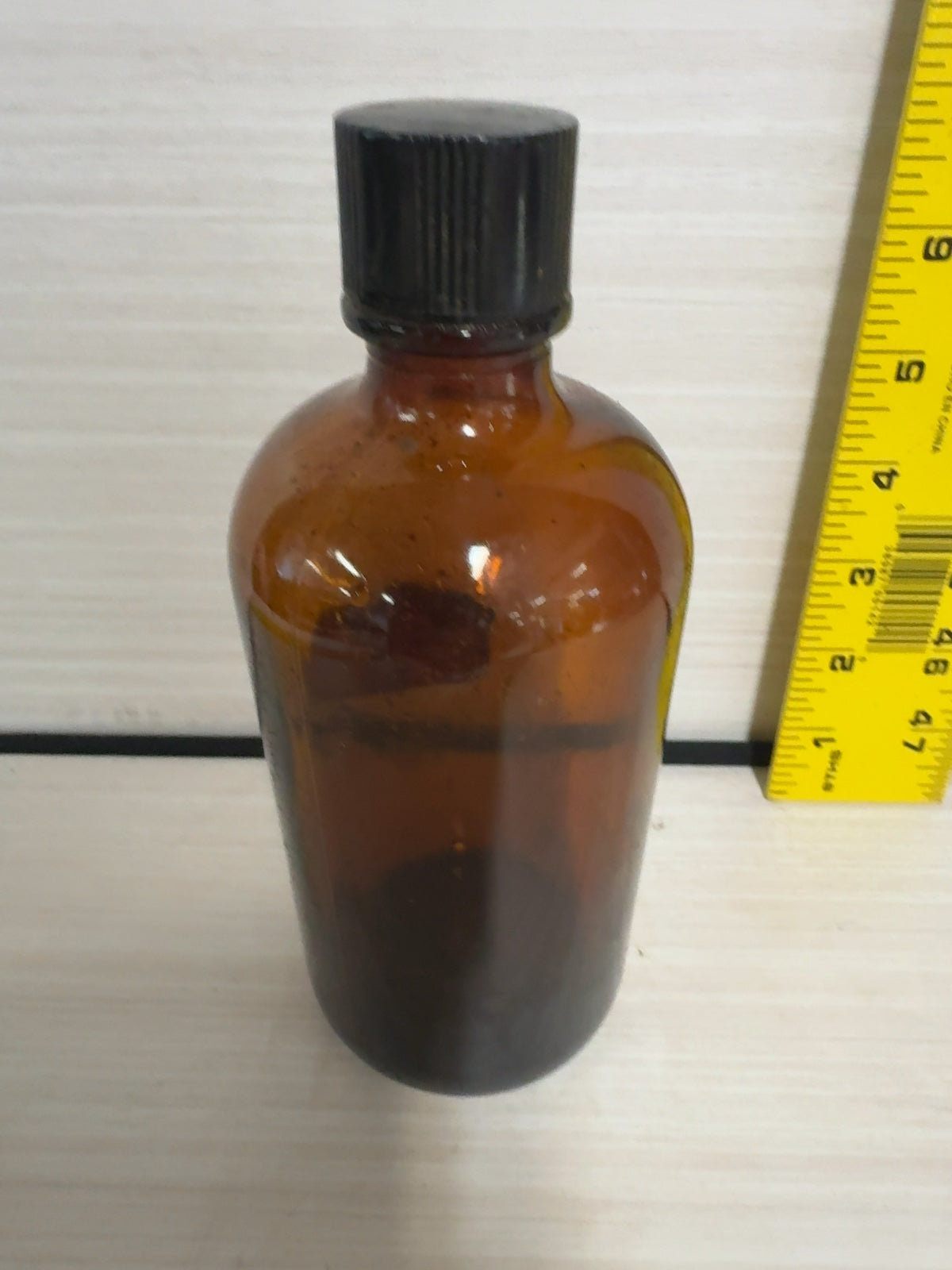 Vintage Amber Glass Boston Round Bottle with Black Bakelite Cap